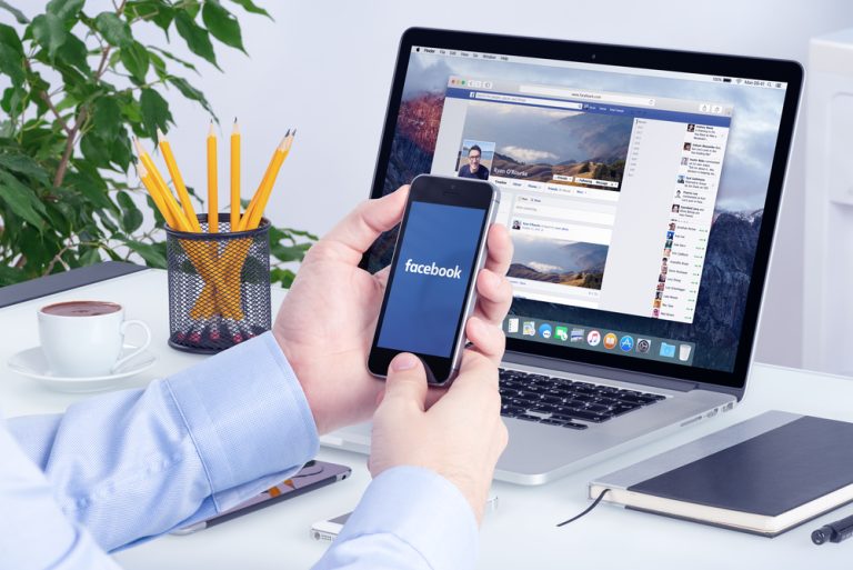Facebook app on the Apple iPhone display and desktop version of